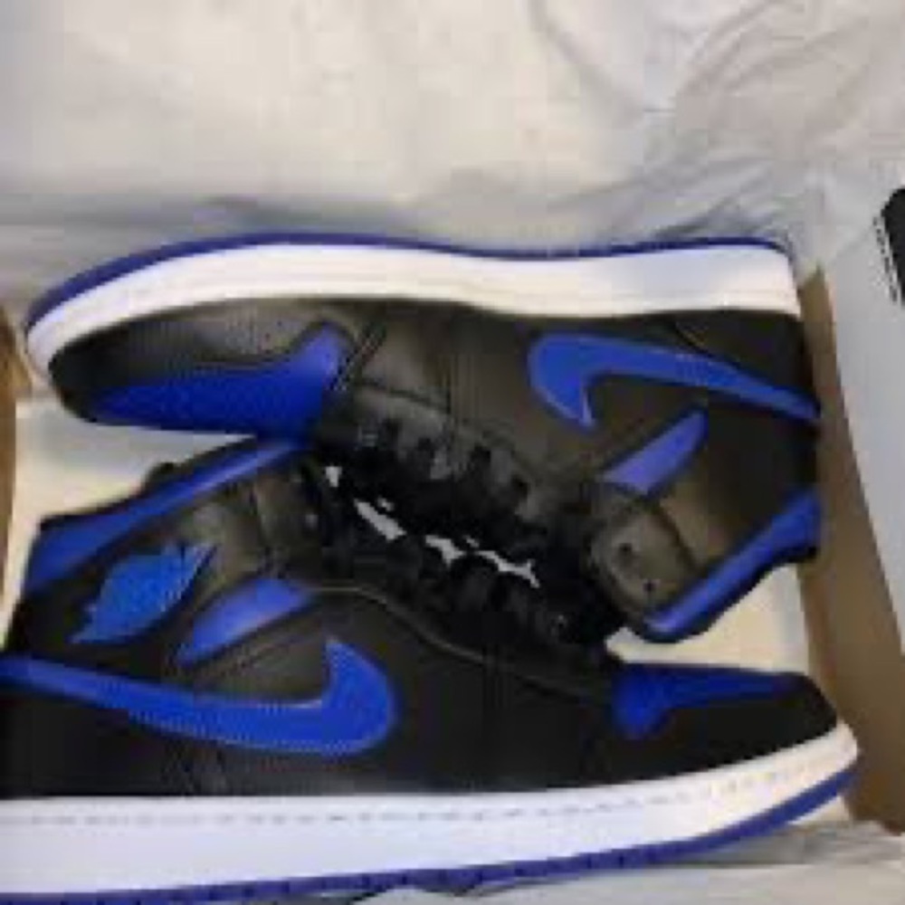Blue black and white Air Jordan mids